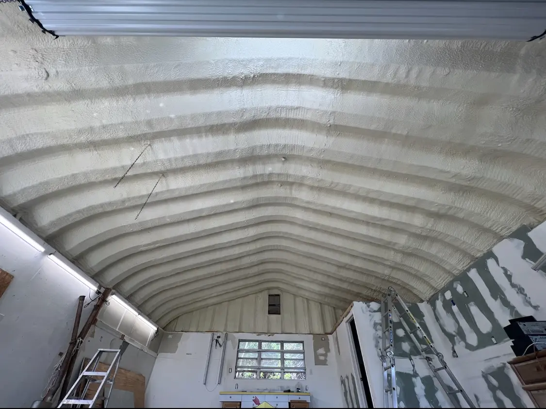 Spray polyurethane foam applied to the underside of a metal roof deck in Colchester
